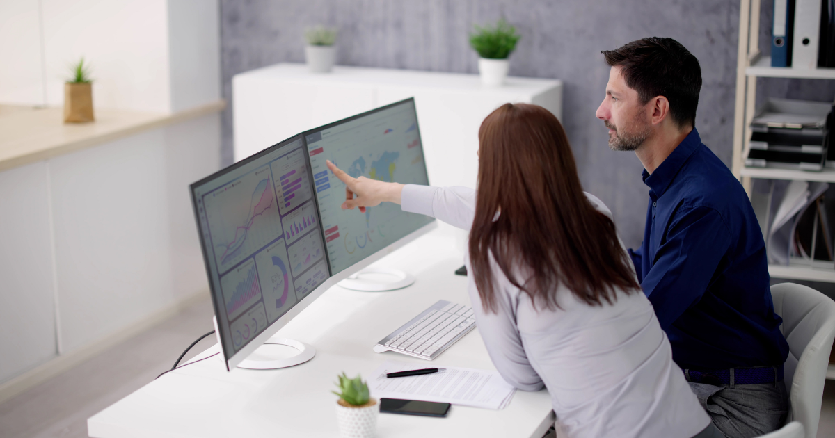 Marketing team analyzing ecommerce analytics dashboard data for performance insights.
