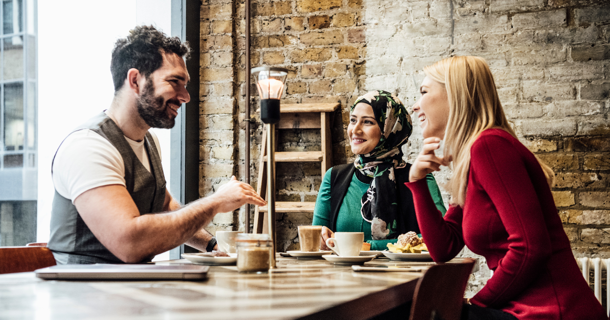 Customer conversation in a coffee shop influencing purchase decisions beyond what analytics dashboards track.