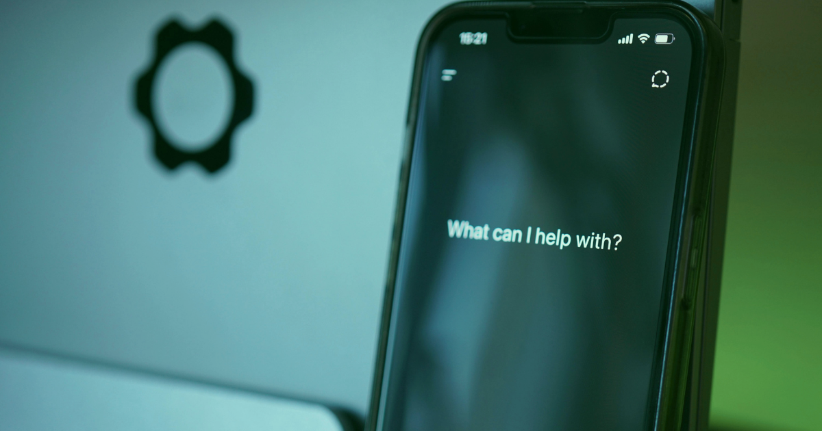 Smartphone displaying AI assistant interface representing AI search and Shopify AI visibility