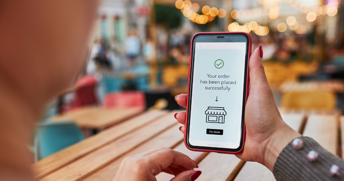 Customer viewing an ecommerce order confirmation on a smartphone.